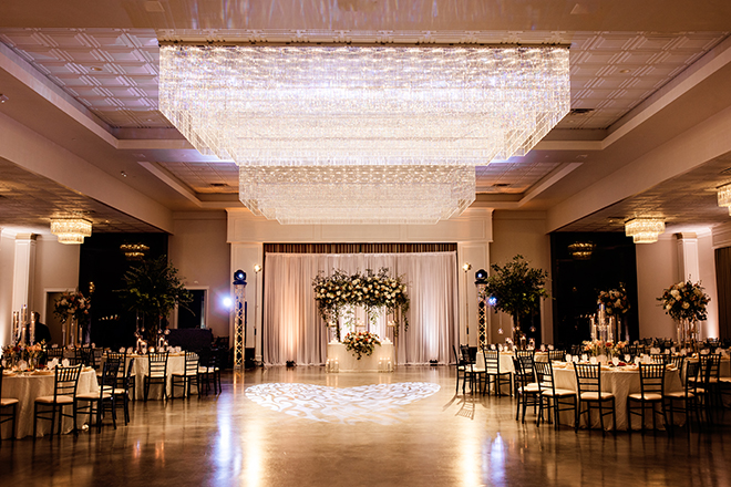 The reception venue is decorated in beige, burnt orange and baby pink colors. 