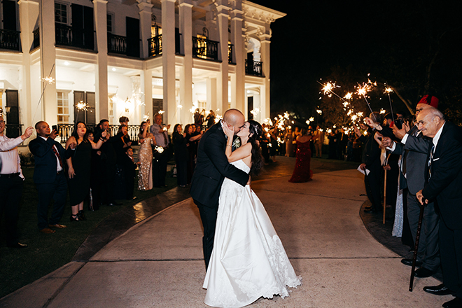 A sparkler send-off concludes the couple's romantic fall wedding.