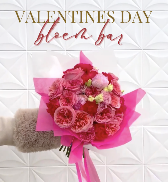 A bouquet of pink and red flowers with "Valentines Day Bloem Bar" written above it. 