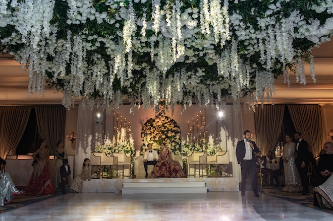 A floral canopy of white florals and greenery hanging over the dance floor in the Houstonian Hotel, Club & Spa. 