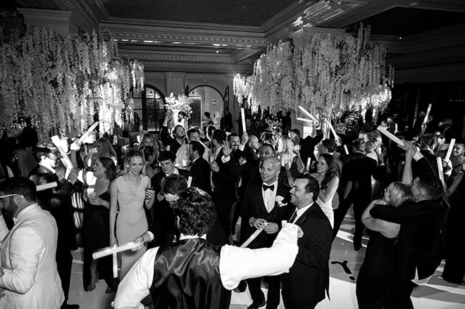 Wedding guests dance at the couple's wedding reception at Le Tesserae.