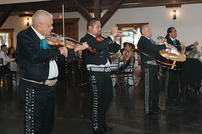 A mariachi band plays for guests at the wedding reception. 