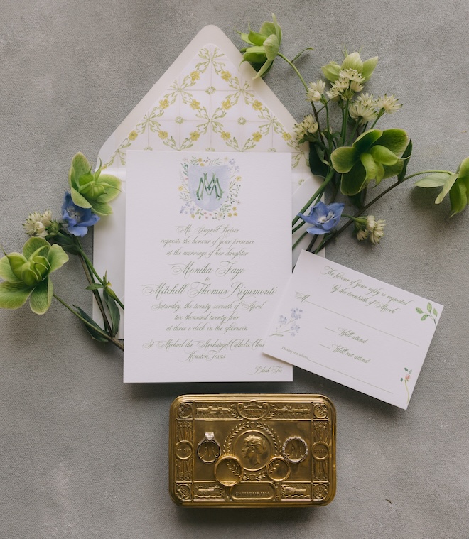 A wedding invitation with yellow, green and blue prints. 