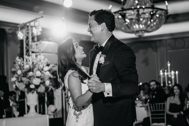 The bride and groom laughing during their first dance. 