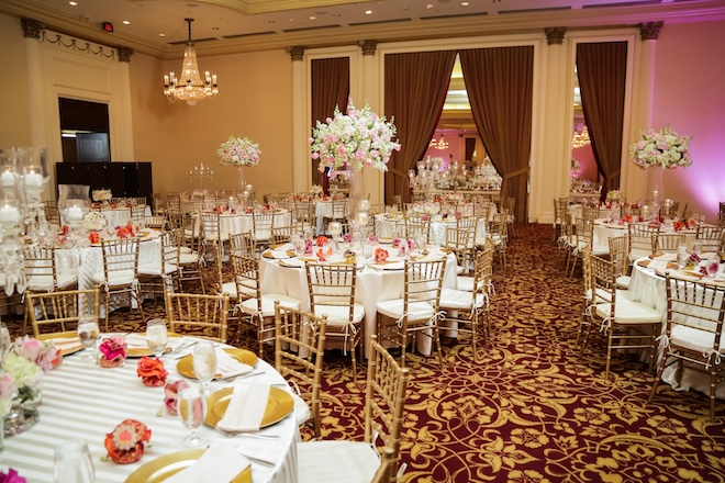 The ballroom at Hilton Houston Post Oak decorated with floral centerpieces.