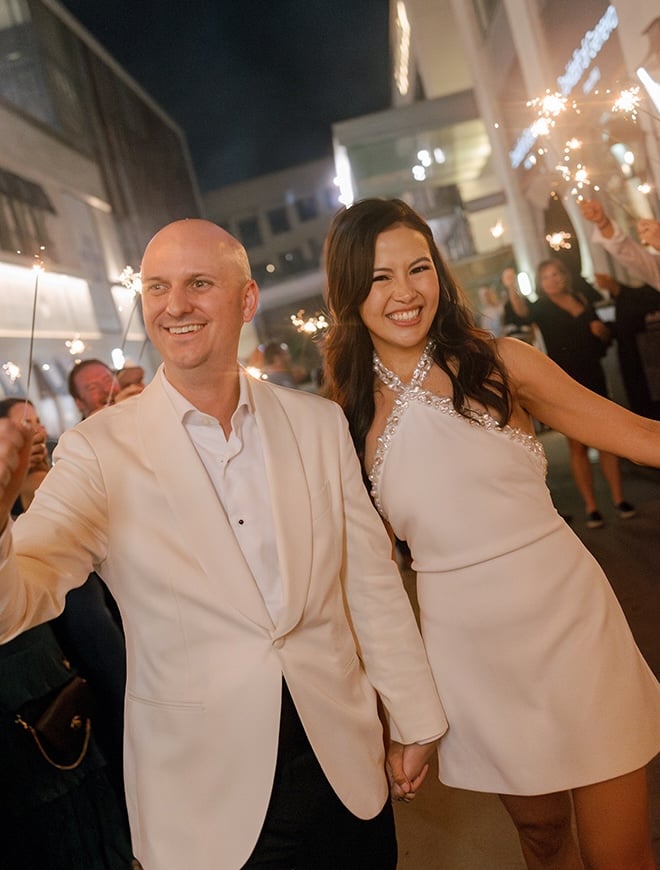 The couple conclude their wedding reception with a sparkler grand exit. 