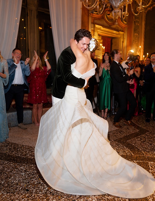 The couple dance at their welcome dinner.