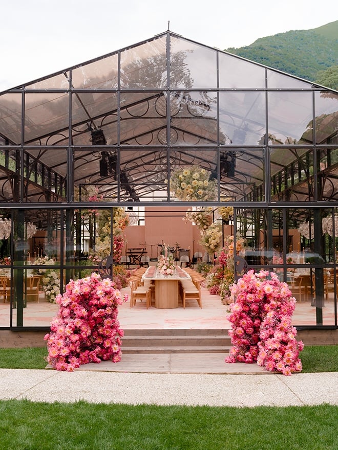 A wedding reception takes place in a glass atrium at Villa Balbiano.