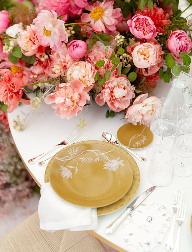 Yellow china is set on the reception tables. 