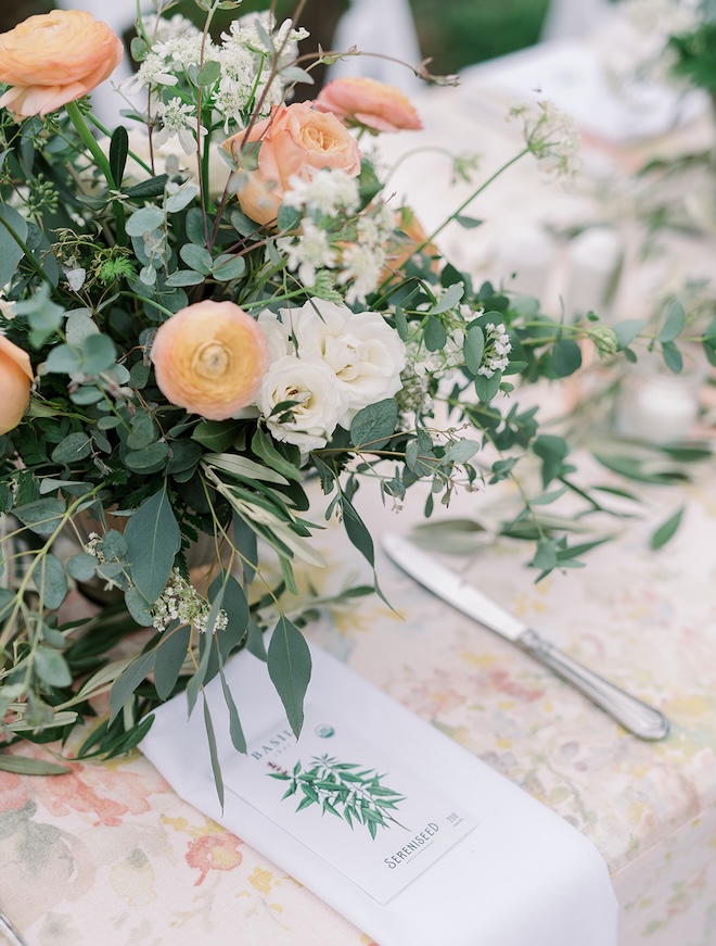 Organic herbs are placed on napkins at wedding reception. 