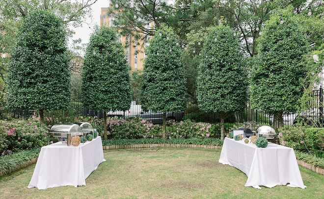 Food stations by Café Natalie are placed for wedding guests to select their food. 