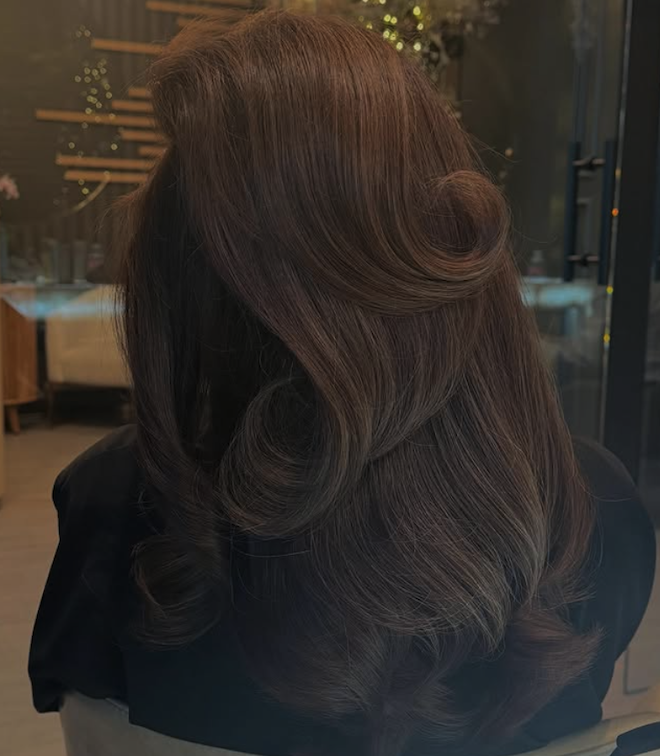 A brunette blowout with curls