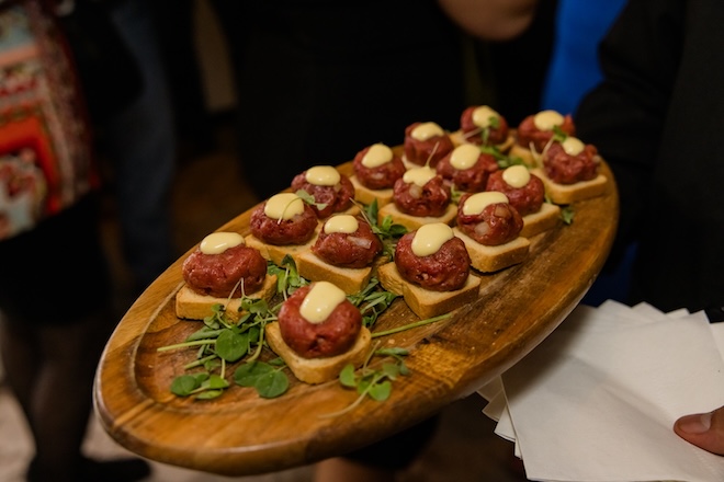 Steak tartare being passed around to guests. 