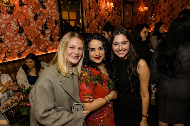 Guests posing for a photo. 