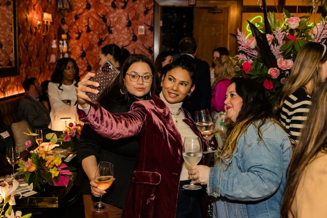 Guests taking selfies in Emilia's Havana. 