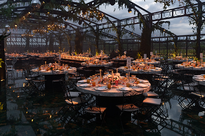 Taper candle and florals detail the tablescapes at the couple's Venetian wedding. 