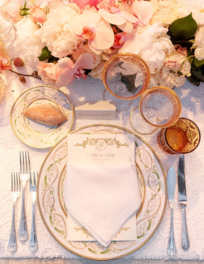 Fine china, orchids and white flowers decorate the reception tables.