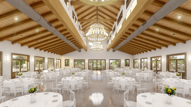 The interior of the new event space with vaulted ceilings and windows. 